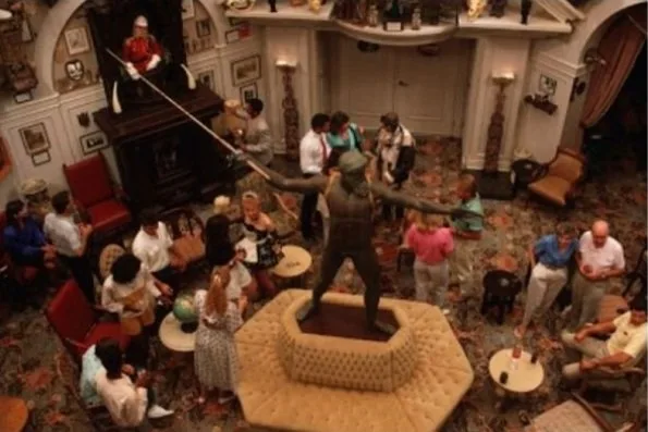 Guests and costumed performers in the ornate Adventurers Club lounge at Disney