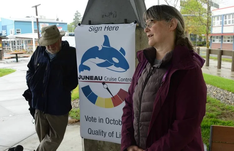 Karla Hart of Juneau Cruise Control talking to reporters outside Juneau City Hall