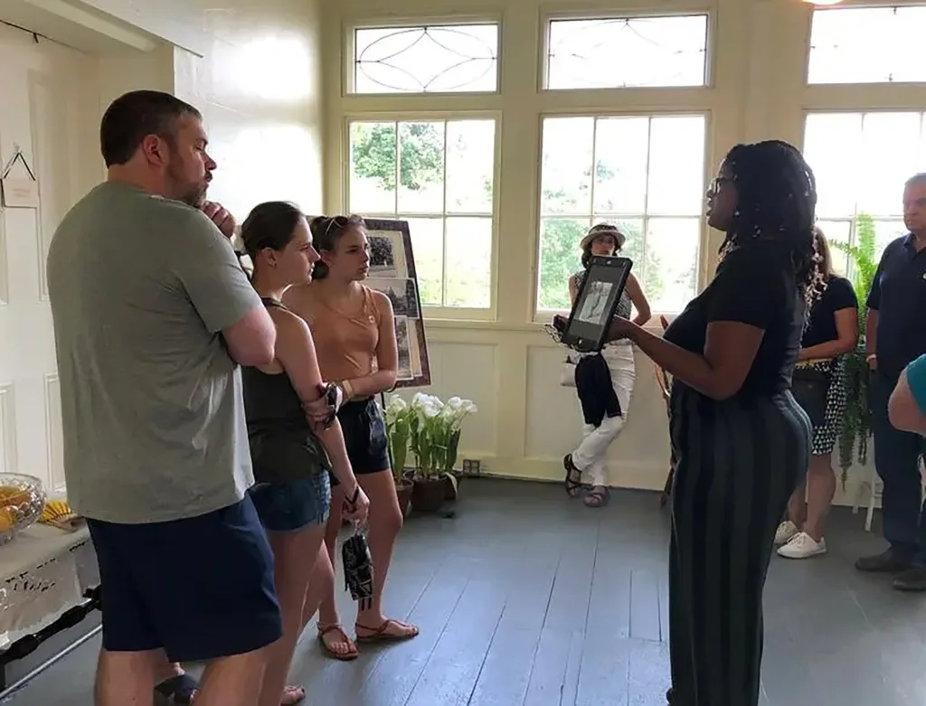Brigette Jones, director of Equitable Partnerships, leading a tour for visitors at Belle Meade