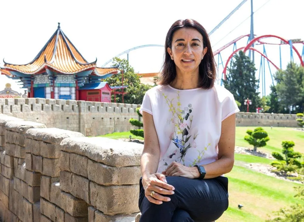 Choni Fernandez Veciana seated on a stone wall in the China-themed area of PortAventura World