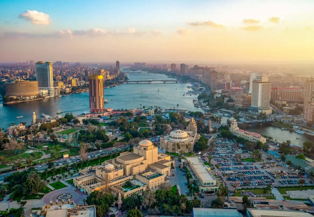 Aerial view of Cairo, Egypt with the Nile River, bridges and city skyline at sunset
