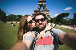 Stock footage of a couple at the Eiffel Tower for "Generationally Speaking" Destinology