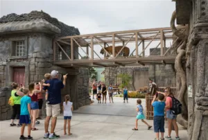 Guests observe a tiger traversing and over-path walk at Tulsa Zoo's Lost Kingdom