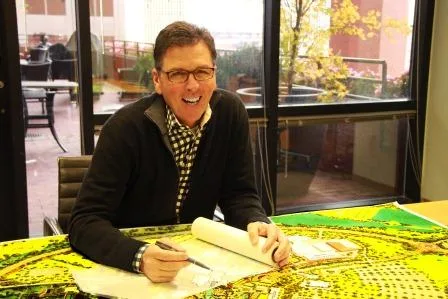 PGAV's Vice President Al Cross laughs over an aerial drawing