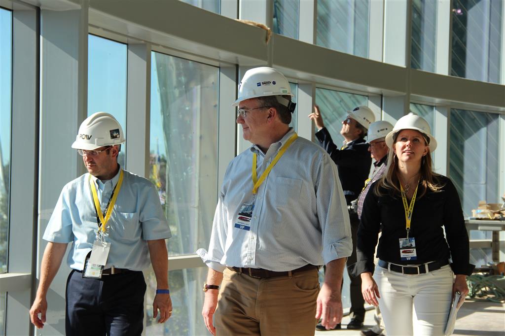 PGAV Principal and Chair Mike Konzen, Vice President Emily Howard, Architect Dave Myers, and Senior Designer Jon Havlik survey the under-construction Space Shuttle Atlantis museum at the Kennedy Space Center Visitor Complex
