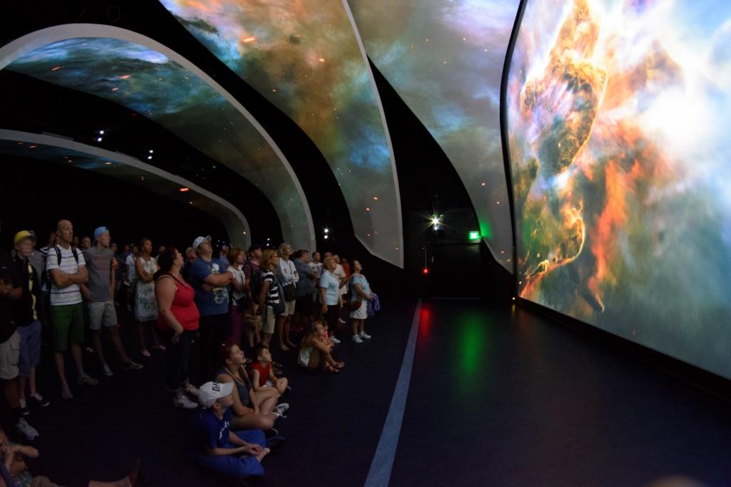 A galaxy covers the reveal theater screens in Space Shuttle Atlantis at Kennedy Space Center Visitors Complex