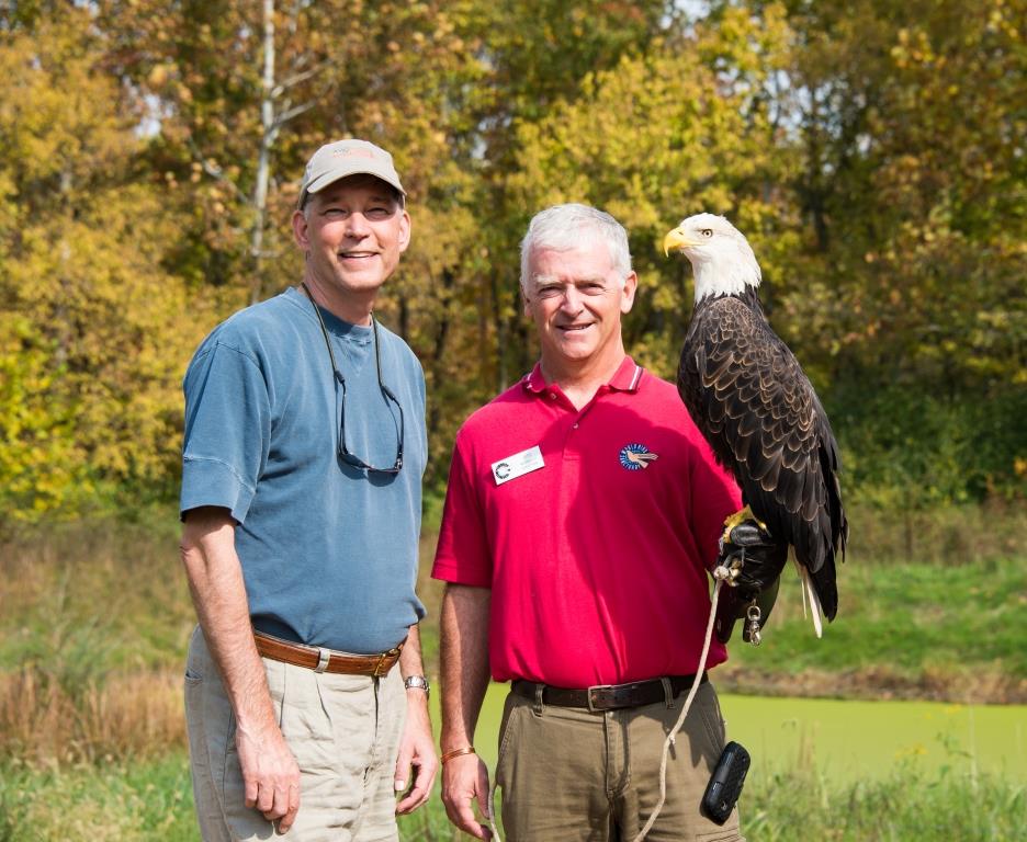 PGAV's Vice President John Kemper and World Bird Sanctuary chair poses with a bald eagle