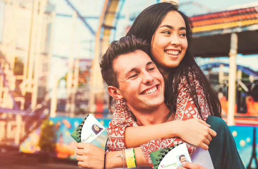 Two guests hold memberships from the Destinology The Value of Membership: Insights into Members and Season Pass Holders