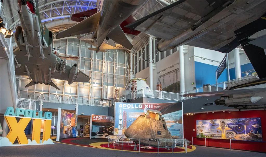 Apollo XII exhibit gallery with the Yankee Clipper command module displayed beneath suspended aircraft