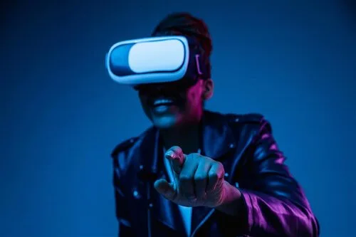 Person in a virtual reality headset reaching toward an unseen object in blue and purple light