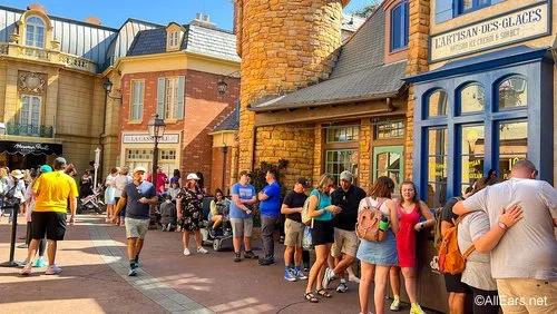 Long line of guests waiting for crepes in the France pavilion at Epcot