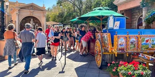 Guests lined up at a food booth in Epcot's Italy pavilion during Festival of the Arts