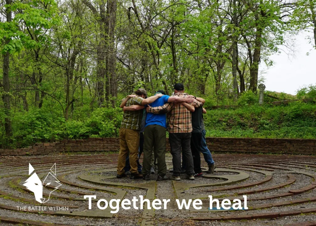 Veterans huddled together on a stone labyrinth in the woods with The Battle Within logo and the words Together we heal