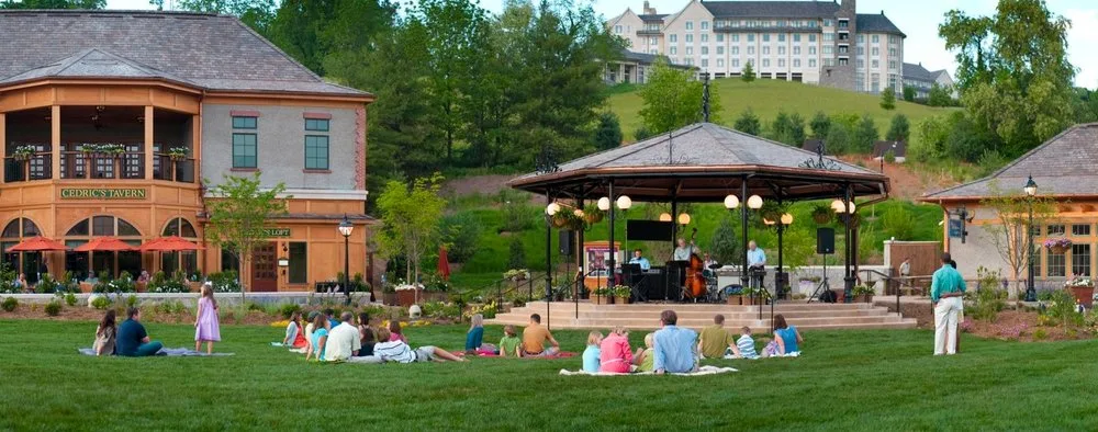 Families picnicking on the lawn during an outdoor concert at Biltmore's Antler Hill Village in Asheville, NC