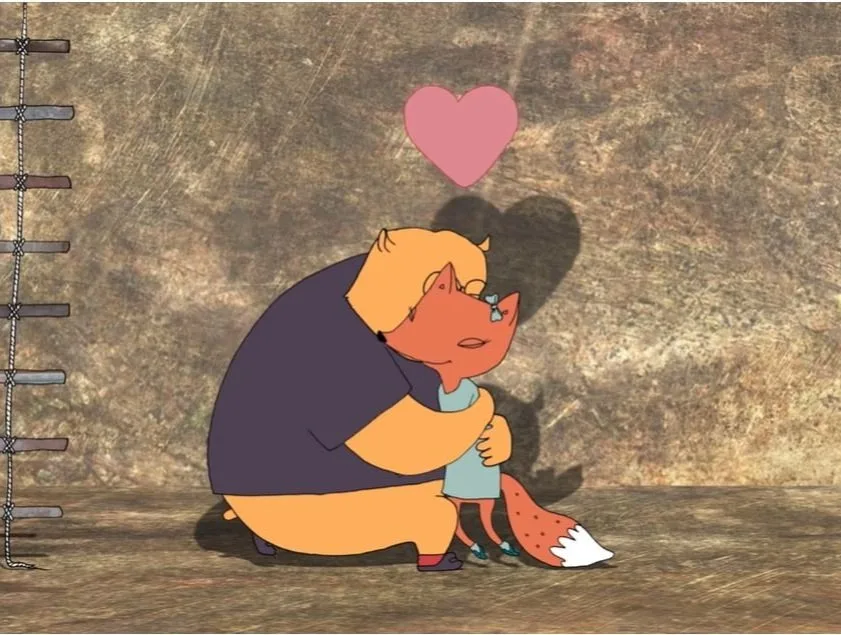 Animated still of a bear hugging a small fox under a pink heart, from Brené Brown's empathy video
