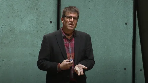 Close-up of the speaker gesturing during his TEDxGatewayArch talk