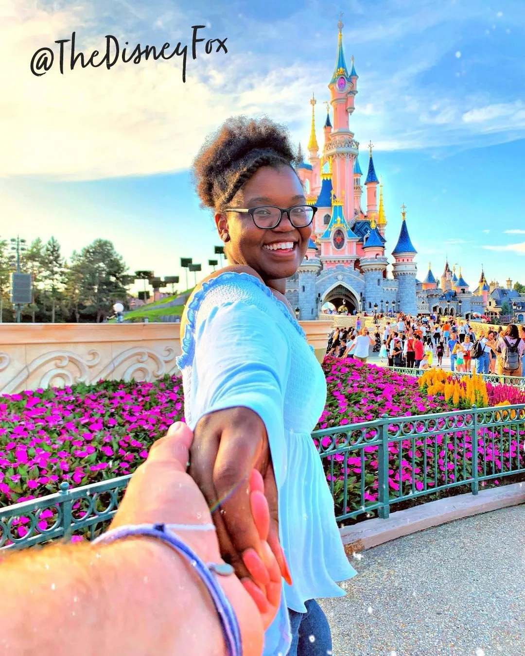 Woman leading the camera by the hand toward Sleeping Beauty Castle at Disneyland Paris, posted by @TheDisneyFox