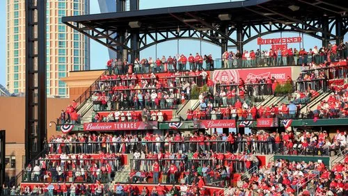 Rooftop terrace seating packed with Cardinals fans above the outfield at Busch Stadium