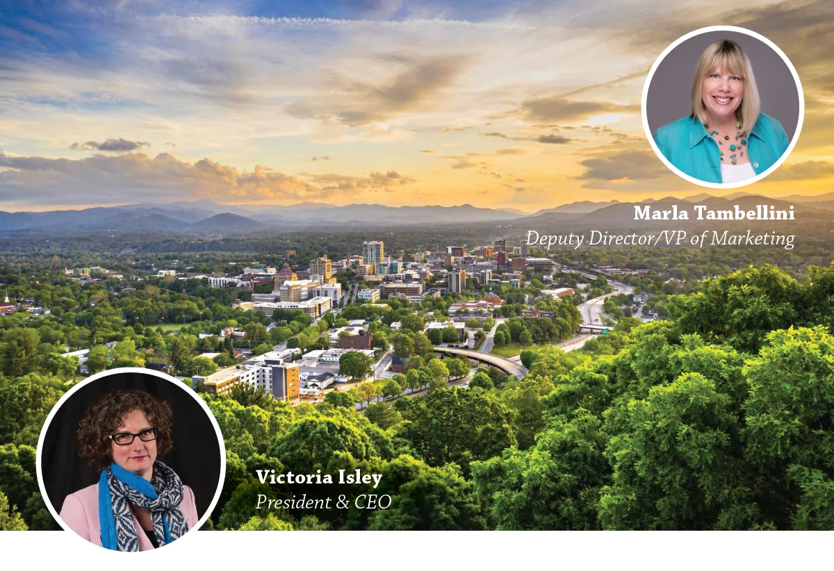 Sunset view over downtown Asheville and the mountains with portraits of Victoria Isley and Marla Tambellini