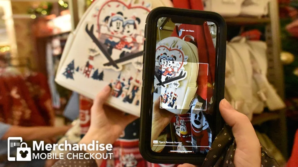Close-up of a phone scanning a Minnie and Mickey backpack's tag with Merchandise Mobile Checkout