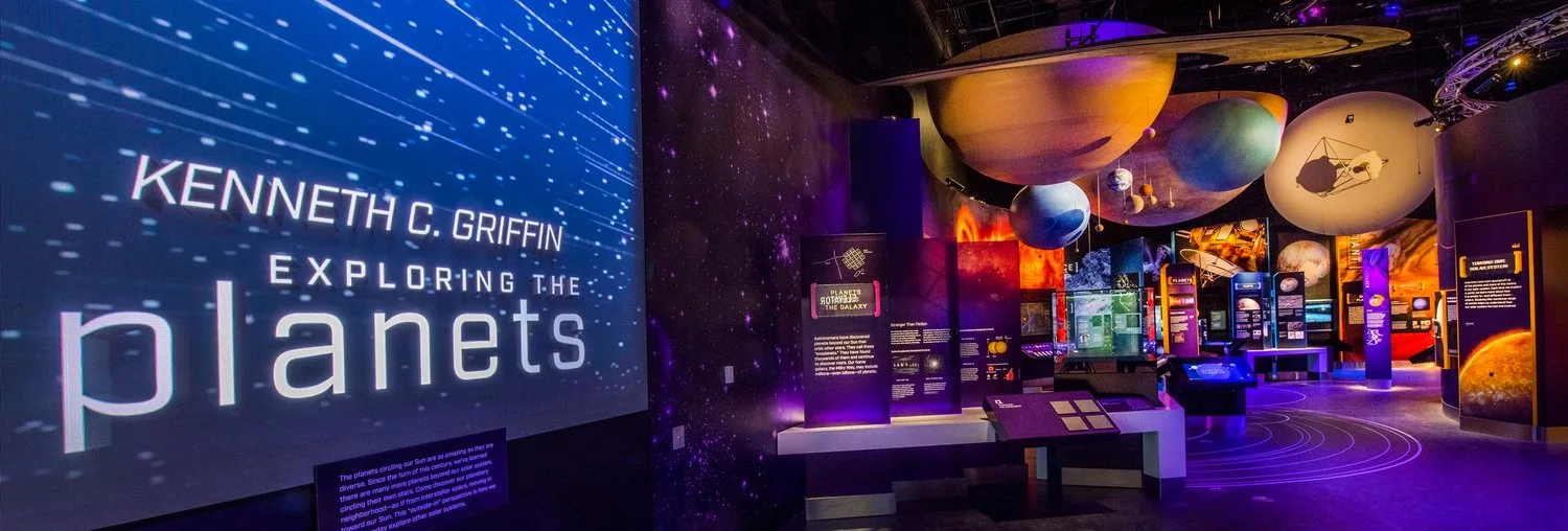 Kenneth C. Griffin Exploring the Planets gallery with suspended planet models and illuminated exhibits