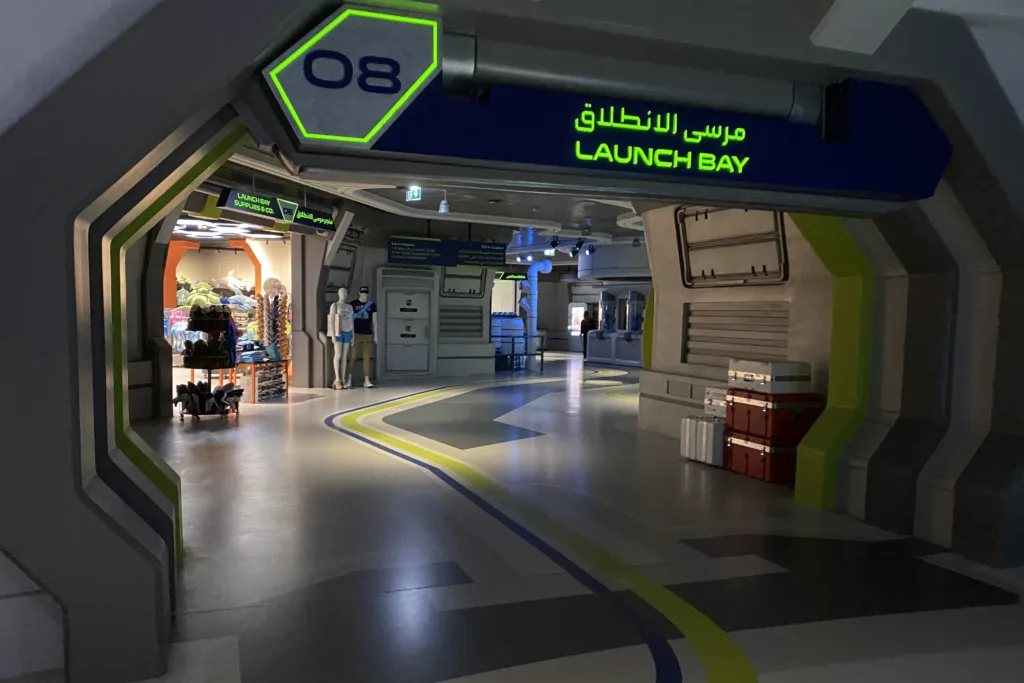 Sci-fi themed corridor with a Launch Bay 08 sign in Arabic and English in the Endless Ocean realm at SeaWorld Abu Dhabi