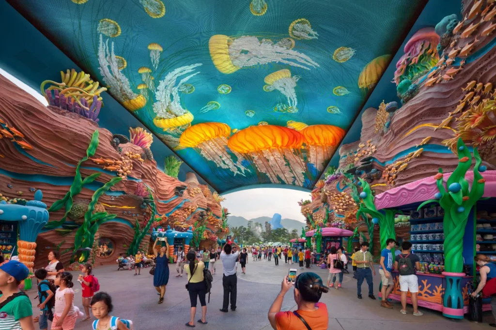 Jellyfish-covered canopy and coral-themed shops along the entry experience at Chimelong Ocean Kingdom in Hengqin, China