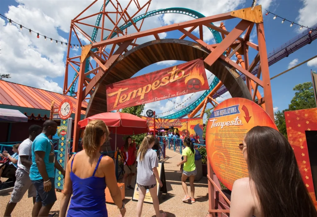 Guests at the entrance archway to the Tempesto roller coaster in Festa Italia at Busch Gardens Williamsburg