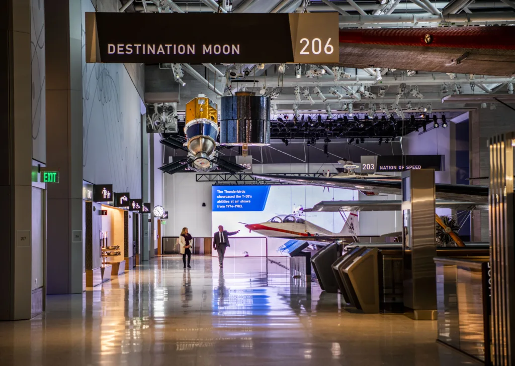 Corridor outside the Destination Moon gallery at the Smithsonian National Air and Space Museum, with spacecraft and aircraft on display
