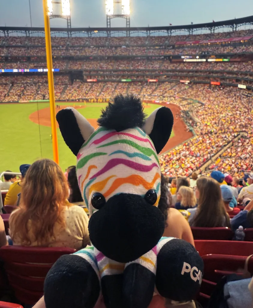 Spot the PGAV zebra plush in the stands at a sold-out Savannah Bananas game at Busch Stadium in St. Louis