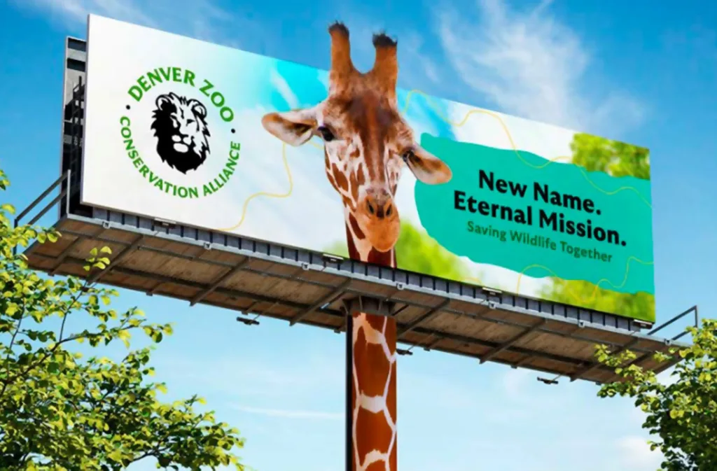 Denver Zoo Conservation Alliance billboard with a giraffe and the headline New Name. Eternal Mission.