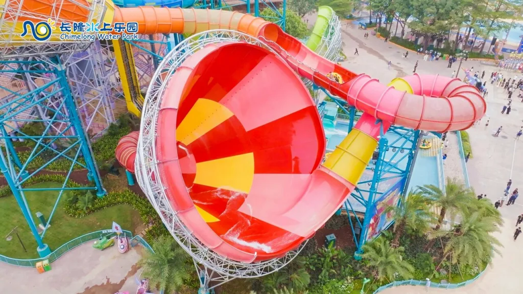 Aerial view of a giant red and yellow funnel waterslide at Chimelong Water Park in Guangzhou