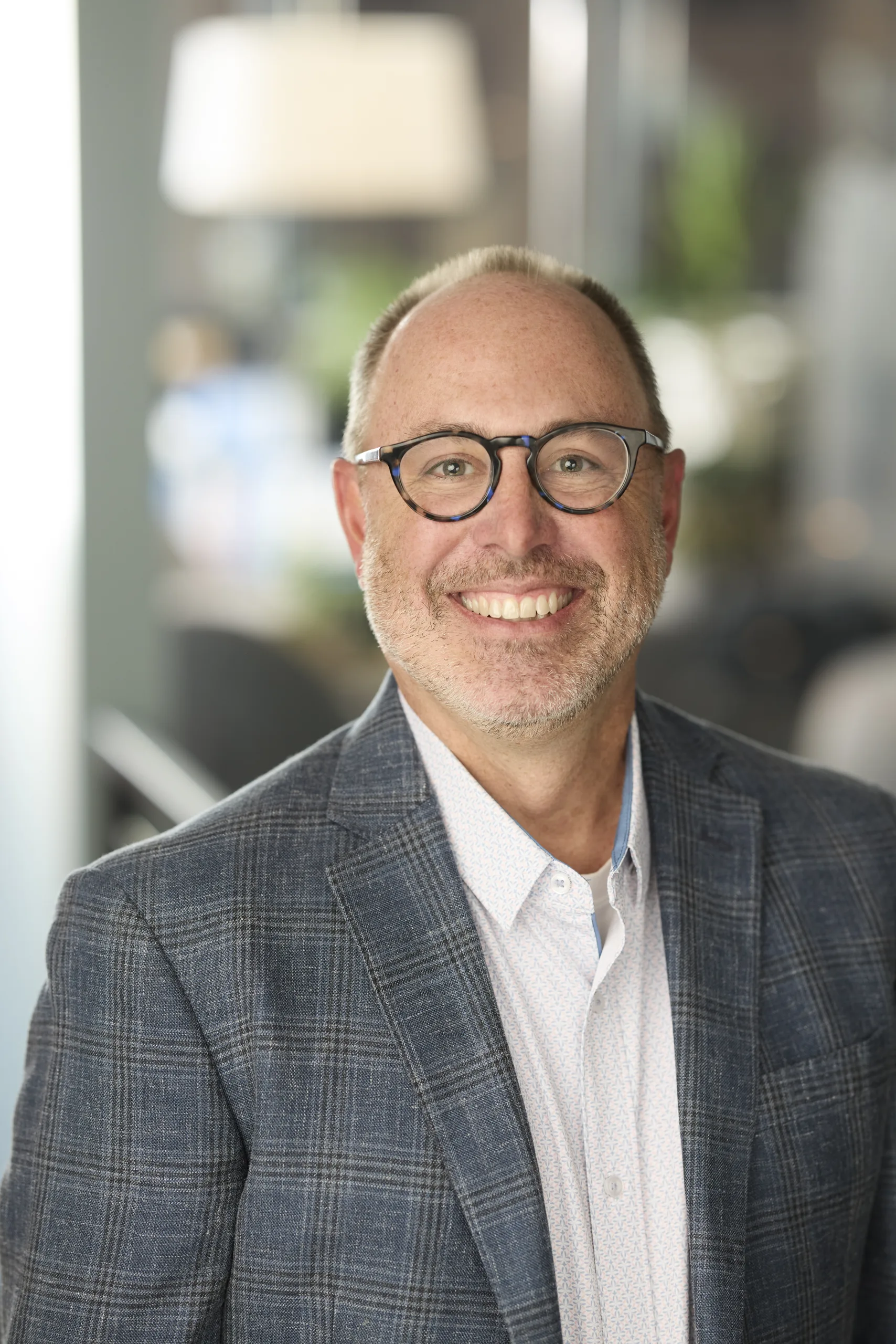 Headshot of John Kasman of PGAV Destinations