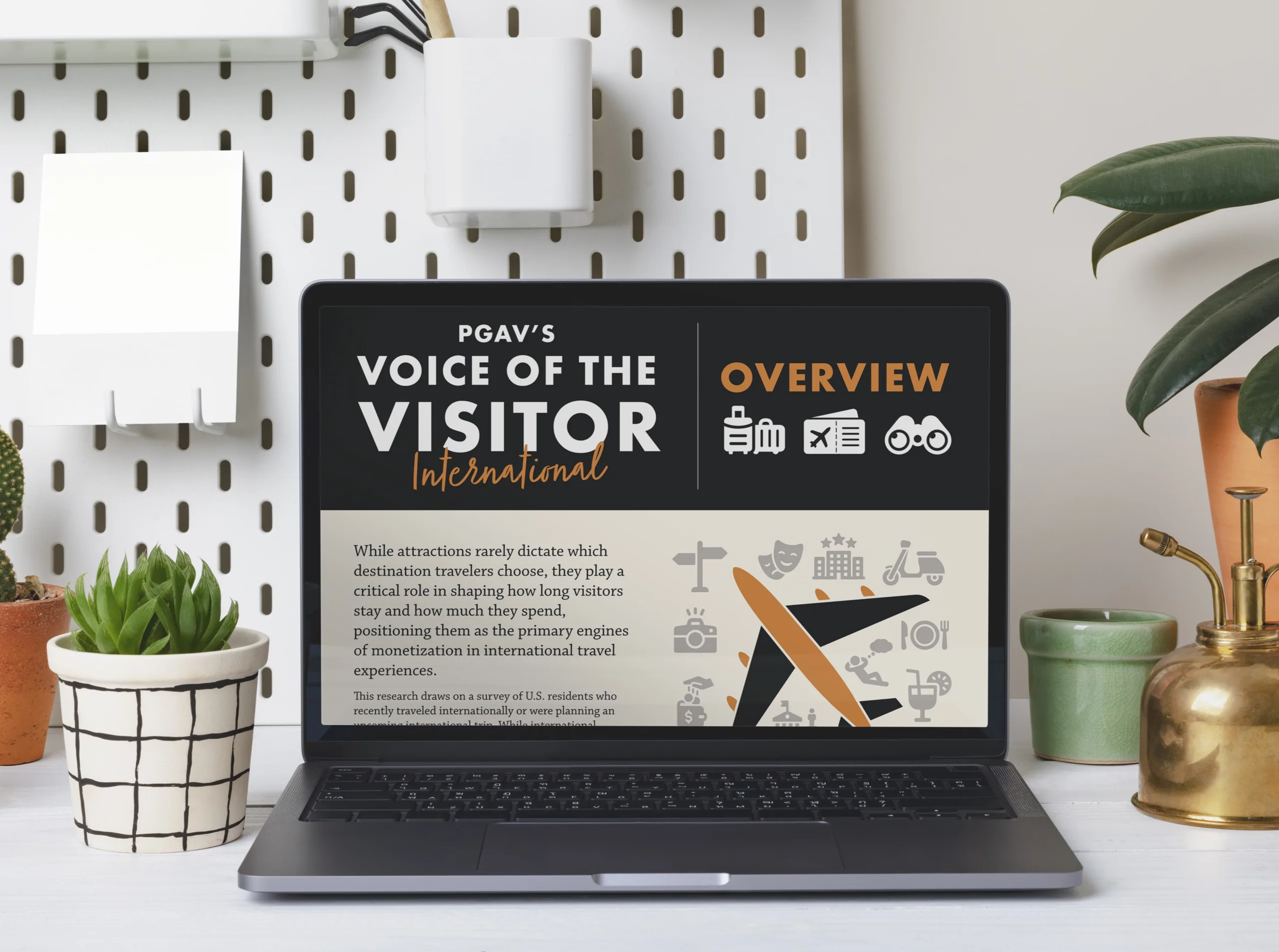 Laptop on a desk displaying the overview of PGAV's Voice of the Visitor International report