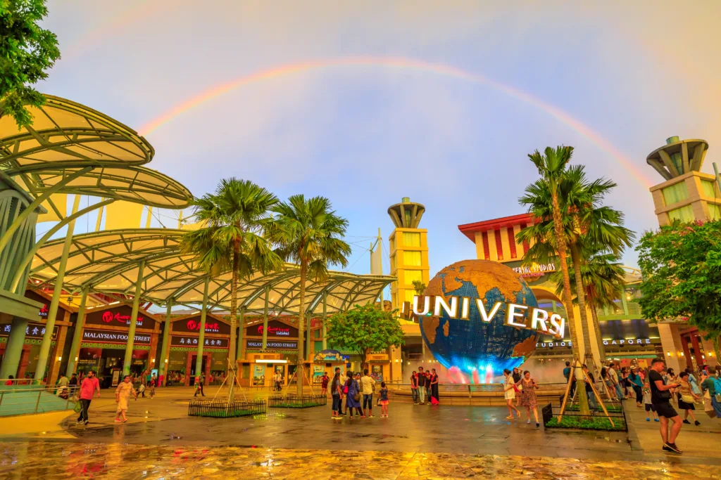 Rainbow over the spinning Universal globe and entry plaza at Universal Studios Singapore