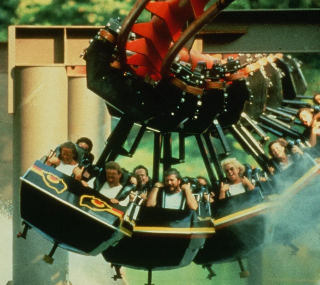 Riders on the suspended Big Bad Wolf coaster at Busch Gardens Williamsburg, in a vintage photo